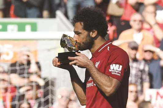 Liverpoolu2019s Mohamed Salah celebrates after being awarded the golden boot award for most goals scored in the Premier League this season. (AFP)
