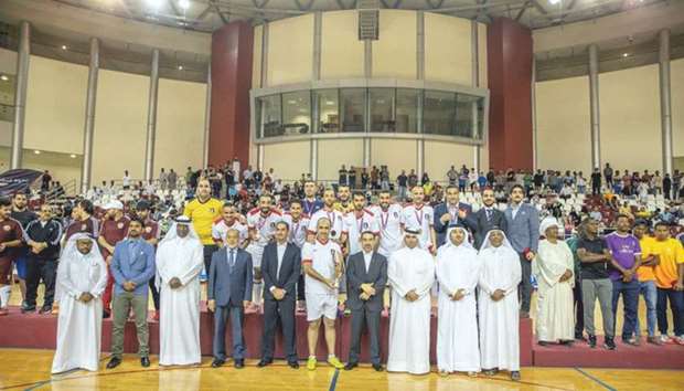 Aspire Zone Foundation and embassy officials pose with the top three teams of the 2018 Aspire Embassies Futsal Tournament u2014 embassy of Jordan, Qataru2019s Ministry of Foreign Affairs and embassy of Sudan respectively.