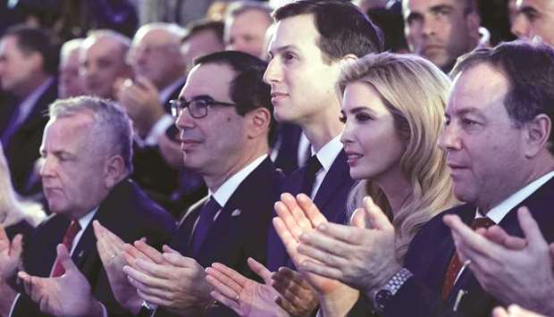 US Deputy Secretary of State John Sullivan, US Treasury Secretary Steven Mnuchin and Senior White House Advisers Jared Kushner and Ivanka Trump clap their hands during a reception held at the Ministry of Foreign Affairs in Jerusalem ahead of the moving of the US embassy, yesterday.