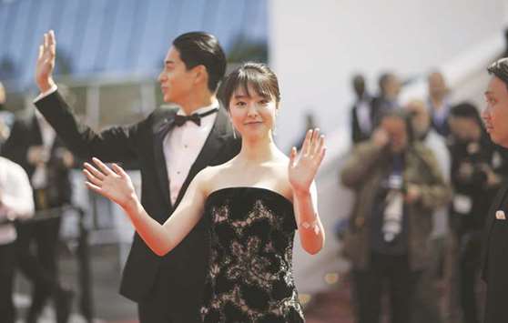 Cast members Masahiro Higashide and Erika Karata pose during the photocall for the screening of the film Asako I & II (Netemo sametemo) yesterday at the 71st edition of the Cannes Film Festival.