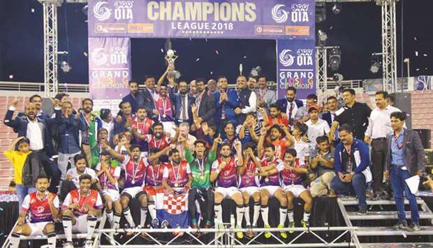 City Exchange TJSV Tea Time FC players and officials celebrate their win in the City Exchange Ria-IME QIA Champions League.