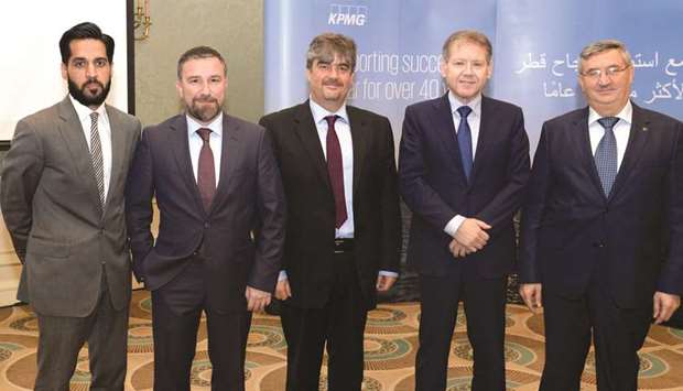 Ozer with KPMG officials at the Qatar-Turkey trade and investment opportunities seminar.