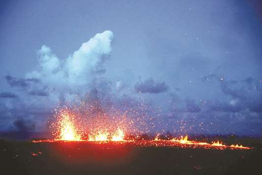 Lava erupts from a fissure on the outskirts of Pahoa during ongoing eruptions of the Kilauea Volcano in Hawaii late on Monday.