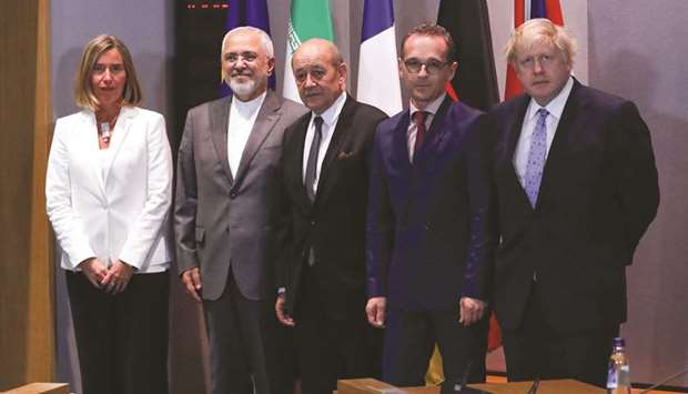 Britainu2019s Foreign Secretary Boris Johnson, German Foreign Minister Heiko Maas, French Foreign Minister Jean-Yves Le Drian and EU High Representative for Foreign Affairs Federica Mogherini take part in meeting with Iranu2019s Foreign Minister Mohamed Javad Zarif in Brussels, yesterday.