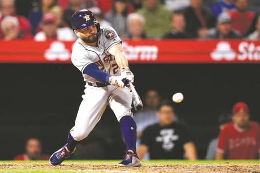 Houston Astros second baseman Jose Altuve hits a three-run double against the Los Angeles Angels during the eighth inning at the Angel Stadium of Anaheim. PICTURE: USA TODAY Sports