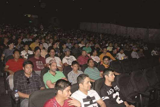 ENTERTAINED: Nepali expatriates watching the movie.