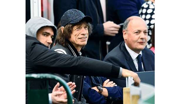 Chief Executive of Cricket Ireland Warren Deutrom (right) with Rolling Stones singer Mick Jagger (centre) during Irelandu2019s debut Test against Pakistan at Malahide Cricket Club in Dublin. (Reuters)
