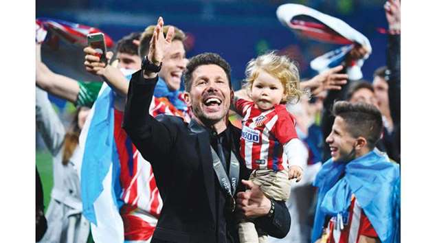 Atletico Madridu2019s Argentinian coach Diego Simeone celebrates with his daughter after the UEFA Europa League final win over Olympique de Marseille. (AFP)