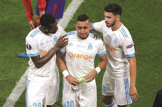 Dimitri Payet (centre) is in tears after he picked up a muscle injury during Wednesday's Europa League final that Marseille lost 3-0 to Atletico Madrid. (AFP)
