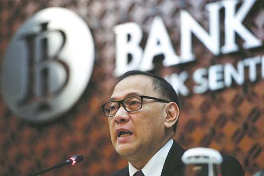 Bank Indonesia governor Agus Martowardojo speaks during a briefing at the banku2019s headquarters in Jakarta. Indonesiau2019s central bank yesterday hiked its benchmark interest rate for the first time since 2014.