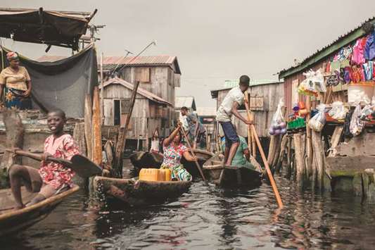 People navigate the the waterways of Makoko waterfront community in Lagos.