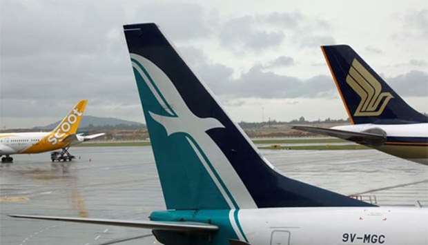 SilkAir, Singapore Airlines and Scoot planes sit on the tarmac at Changi Airport in Singapore. File picture