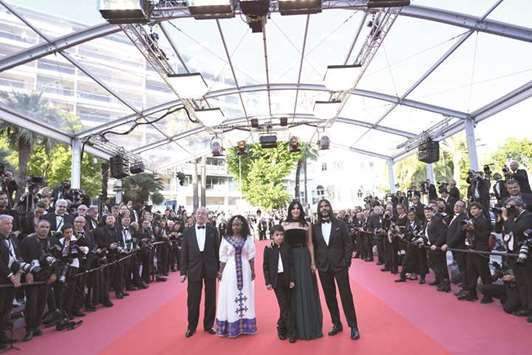 Ethiopian actress Yordanos Shifera (second left), Lebanese actor Zain Alrafeea, Lebanese director and actress Nadine Labaki, Lebanese producer Khaled Mouzanar (right) and an unidentified man pose on the red carpet yesterday for the screening of Capernaum at the 71st edition of the Cannes Film Festival.