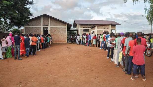 People wait in a line to vote for the referendum on a controversial constitutional reform in Ngozi, northern Burundi