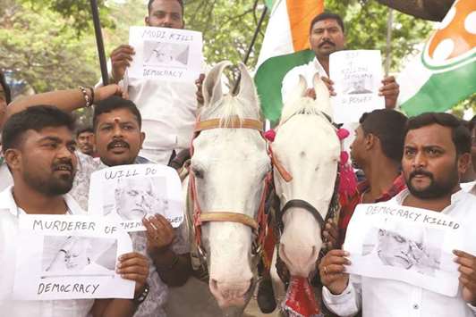 Congress workers participate in a protest rally against Karnataka governor Vajubhai R Valau2019s decision to administer oath to BJP legislature party leader B S Yeddyurappa in Bengaluru yesterday.