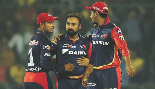 Delhi Daredevilsu2019 Amit Mishra (centre) celebrates the wicket of Chennai Super Kingsu2019 Sam Billings (not in the picture) with his teammates during the IPL match at the Feroz Shah Kotla cricket stadium in New Delhi yesterday. (AFP)