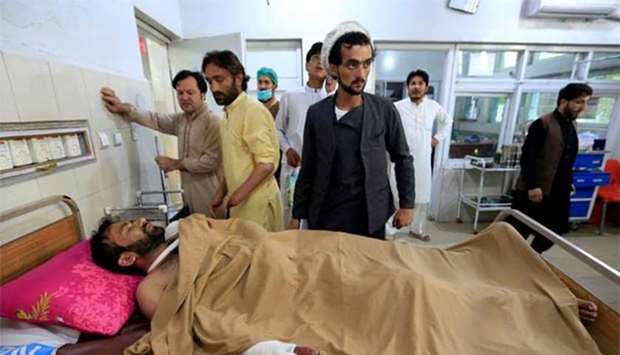An injured man receives treatment in a hospital, after blasts at a sports stadium in Jalalabad, on Saturday.