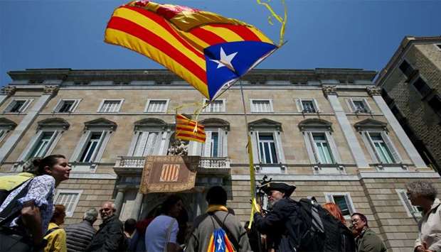 A man waves an ,Estelada,, Catalan separatist flag, outside the Generalitat Palace in Barcelona