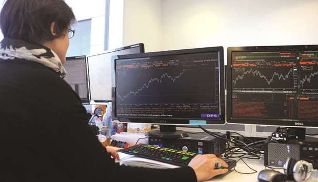A trader works at the London Stock Exchange. The LSE has laid out the blueprint for its long-awaited trading link with Shanghai, an initiative that will further Chinau2019s  efforts to integrate with the international financial system.