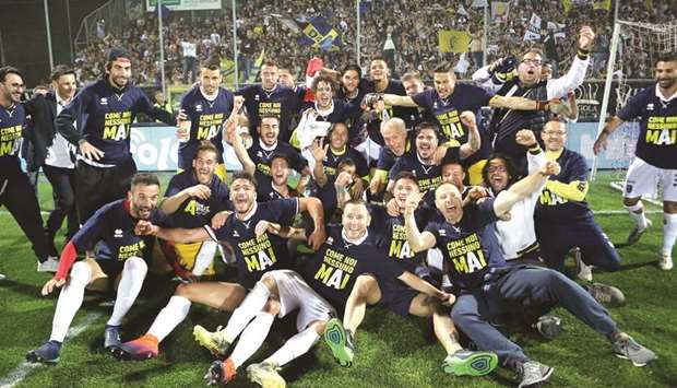 Parmau2019s players celebrate after victory at Spezia sealed a return to the Italian top flight.
