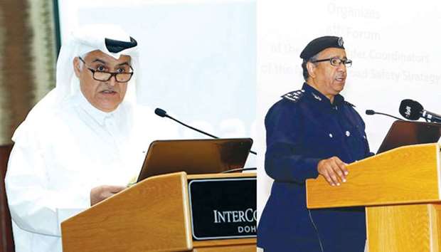 Brigadier Mohamed Abdullah al-Malki addressing the forum. Right: Brigadier Mohamed Saad bin al-Kharji speaking at the meeting.