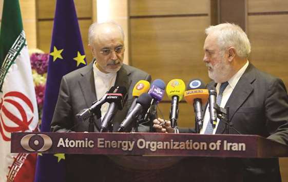 Head of the Iranian Atomic Energy Organisation, Ali Akbar Salehi (left) and Miguel Arias Canete, European Union Energy Commissioner, speak to the press after meeting in the capital Tehran, yesterday.