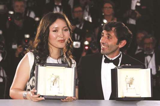 Samal Yeslyamova, with her Best Actress award for her role in The Little One (Ayka), and Marcello Fonte, with his Best Actor award for his role in Dogman.