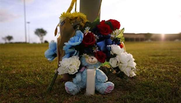 Makeshift memorials in memory of the shooting victims are seen at the Santa Fe High School in Santa Fe, Texas, on Sunday.