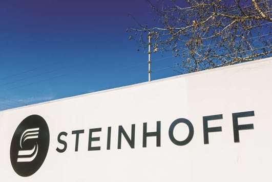 A Steinhoff International logo sits on display outside the companyu2019s offices in Stellenbosch, South Africa (file). Steinhoff is seeking a three-year extension on most of its u20ac9.6bn of debt as the retailer battles to come to grips with an accounting scandal thatu2019s wiped more than 96% off the share price.