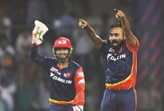 Delhi Daredevilsu2019 Amit Mishra (right) celebrates the wicket of Mumbai Indiansu2019 Hardik Pandya with a teammate during the 2018 Indian Premier League match at the Feroz Shah Kotla Cricket Stadium in New Delhi yesterday. (AFP)