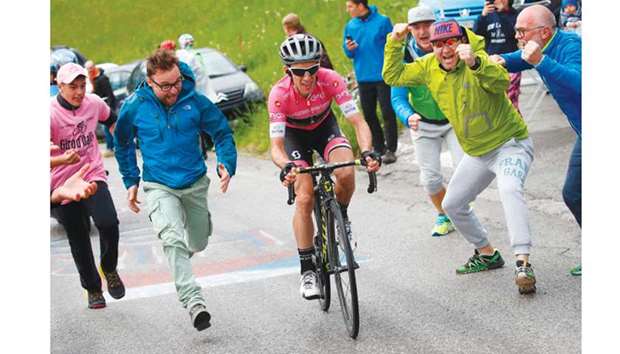 People cheer for Mitchelton-Scottu2019s British rider Simon Yates during the 15th stage between Tolmezzo and Sappada of the 101st Giro du2019Italia yesterday. (AFP)