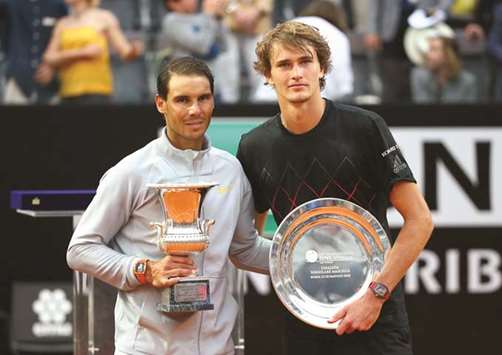 Rafael Nadal and Alexander Zverev pose with their respective trophies.