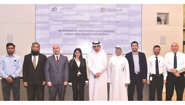 QU, Microsoft Qatar officials at the signing ceremony.