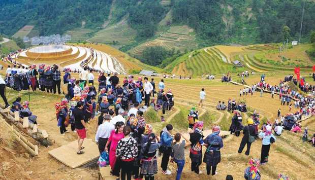 Tourists arrive to visit an art installation titled u2018Crystal Cloudu2019 featuring 58,000 shimmering beads on top of a hill in Yen Bai province of Vietnam.