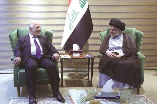 This handout picture released by the Iraqi Prime Ministeru2019s press office yesterday, shows Iraqi Prime Minister Haider al-Abadi meeting with cleric and leader Moqtada al-Sadr in Baghdad.