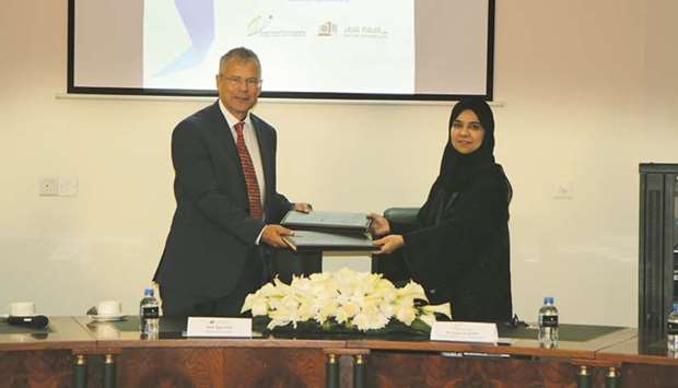 Officials at the MoU signing ceremony between PHCC and QU.