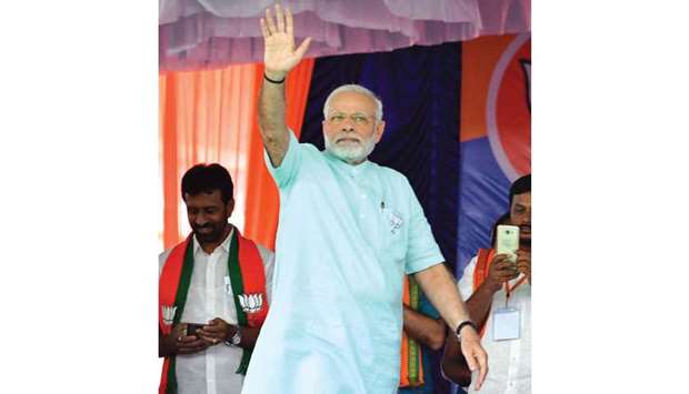 Prime Minister and BJP leader Narendra Modi waves during a party rally ahead of Karnataka Assembly polls in Chamarajanagar yesterday.