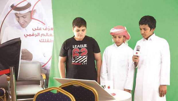 Young boys participate in an activity during the Vodafone AmanTECH school workshop.