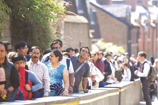 People queue to visit Windsor Castle, in Windsor, yesterday.