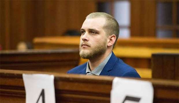 Henri van Breda sits in the dock at the Western Cape High Court to hear the verdict in his trial for allegedly killing his parents, brother and maiming his sister with an axe in their luxury home, in Cape Town on Monday. The attack took place at a luxury secure-estate in Stellenbosch on January 27, 2015.