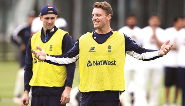 Englandu2019s Jos Buttler (right) with Chris Woakes during a net session at the Lordu2019s Cricket Ground in London yesterday. (Reuters)