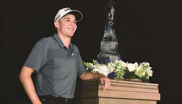 Aaron Wise poses with the trophy after winning the AT&T Byron Nelson in Dallas, Texas, on Sunday. (AFP)