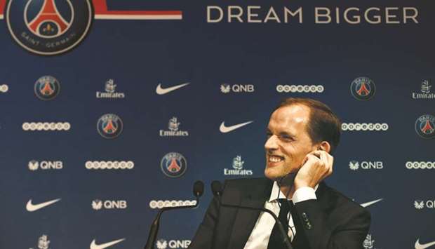 Paris Saint-Germainu2019s newly-appointed coach German Thomas Tuchel smiles during a press conference on Sunday. (AFP)
