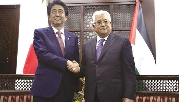 Japanese Prime Minister Shinzo Abe meets with Palestinian President Mahmoud Abbas in the West Bank city of Ramallah, yesterday.