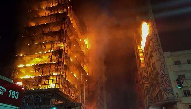 Flames engulfing a building in the city centre of Sao Paulo. A 24-storey building in the center of Sao Paulo, Brazil's biggest city, collapsed early May 1 after a blaze that rapidly tore through the structure.