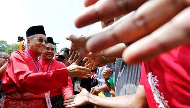 Mahathir Mohamad shakes hands with his supporters after his nomination, on Langkawi island last week.