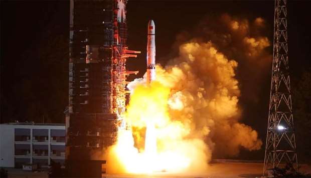 A Long March-4C rocket lifts off from the southwestern Xichang launch centre carrying the Queqiao (,Magpie Bridge,) satellite in Xichang