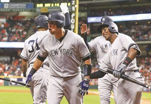 New York Yankees catcher Gary Sanchez (left) celebrates with teammates after hitting a home run during the ninth inning against the Houston Astros at Minute Maid Park. PICTURE: USA TODAY Sports