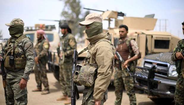 Fighters of Syrian Democratic Forces (SDF) are seen in Deir al-Zor, Syria. May 1, 2018 file picture