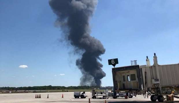Smoke rises from the airplane crash near Savannah airport, Georgia, US